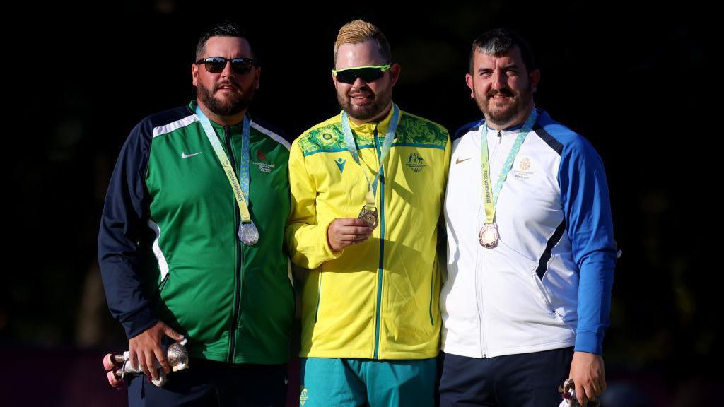 Gary Kelly on the podium with Aaron Wilson and Iain McLean