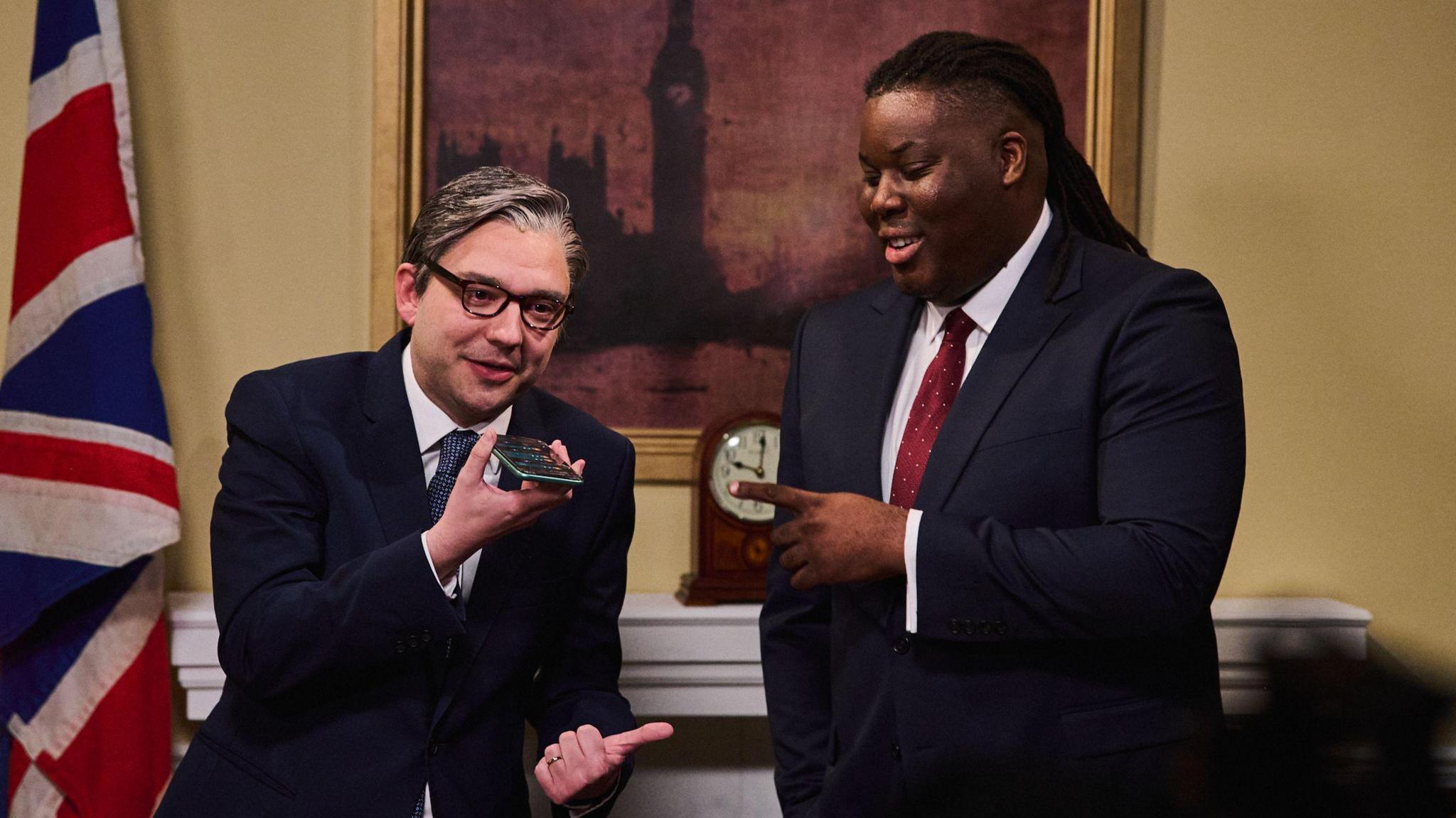 George Fouracres (as Sir Keir Starmer) and Hammed Animashaun (as David Lammy) in a sketch set in 10 Downing Street.
