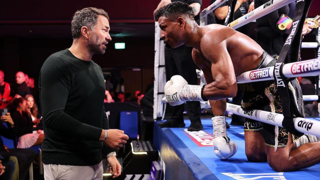 Bilal Fawaz speaks to Eddie Hearn after beating Ryan Kelly in Wolverhampton to defend his British and Commonwealth titles