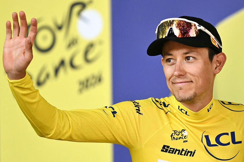 Torstein Traeen celebrates on the podium with the overall leader's yellow jersey after the fourth stage of the 113th edition of the Tour de France