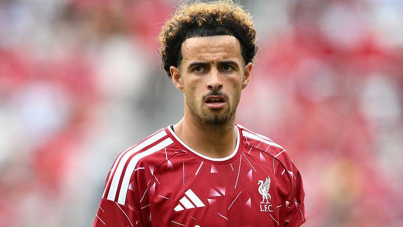 Curtis Jones in a Liverpool shirt