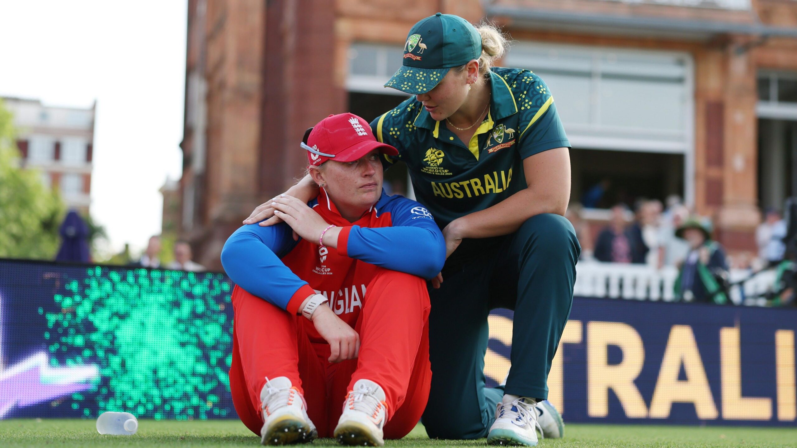 Sophie Ecclestone is consoled by Georgia Voll