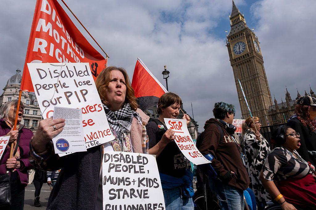 Protesters gather to demonstrate in Westminster against cuts to the welfare state and benefits and asking for the rich to be taxed ahead of Chancellor Rachel Reeves' Spring Statement speech to Parliament