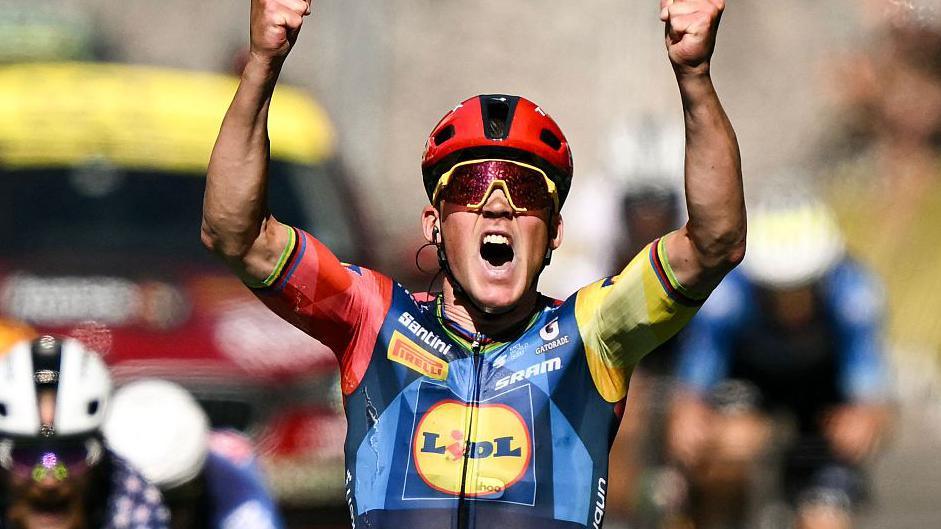 Lidl - Trek team's Danish rider Mads Pedersen celebrates as he crosses the finish line to win the 4th stage of the 113th edition of the Tour de France