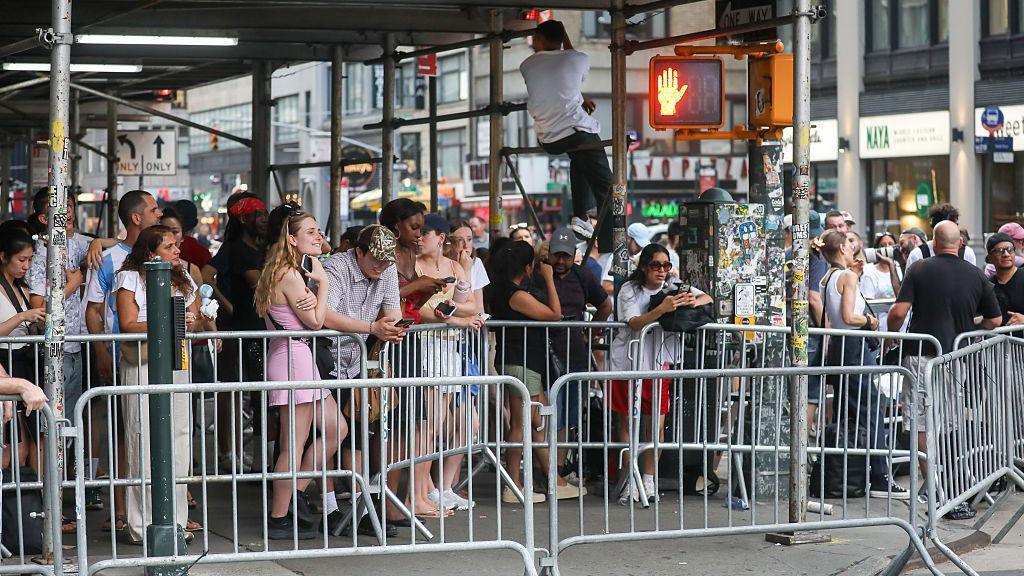 People gathered behind barricades near Madison Square Garden