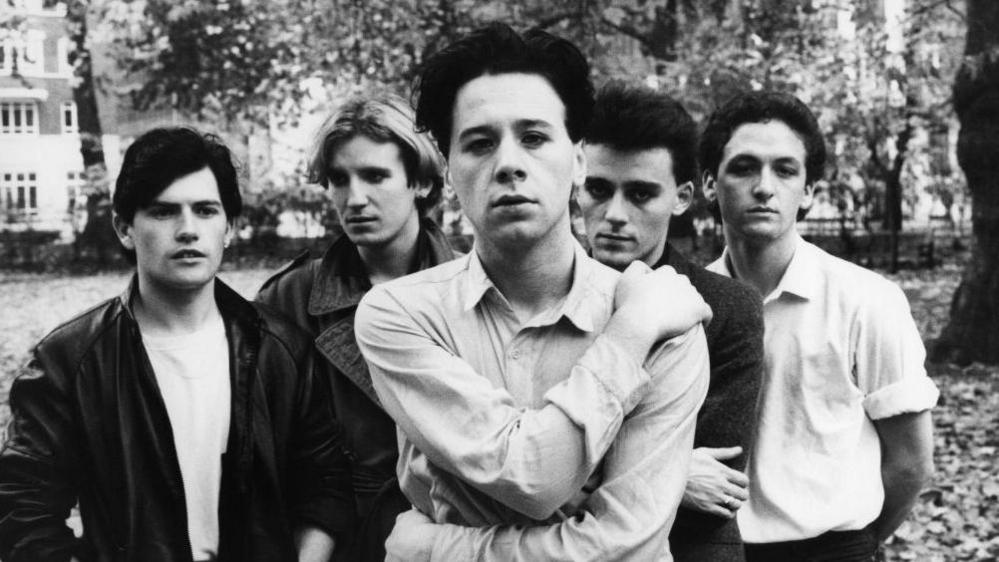 Black and white image of Simple Minds taken from a photoshoot in 1980