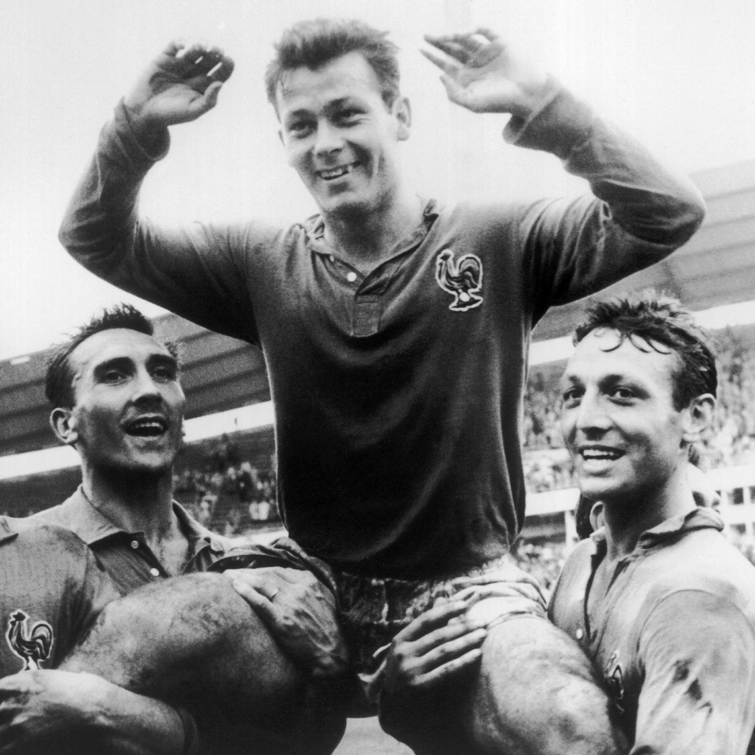 Just Fontaine being held up by his France team-mates at the 1958 World Cup
