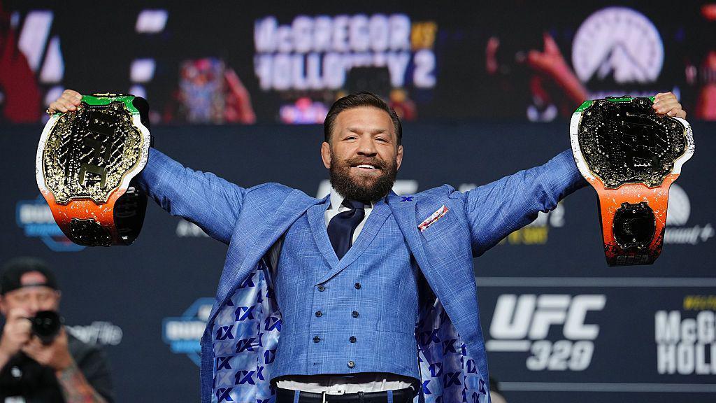 Conor McGregor holds two titles at the UFC 329 news conference