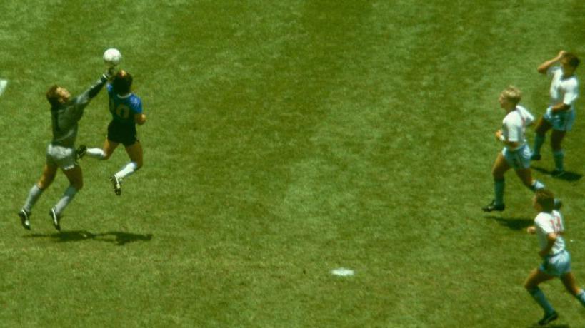 Diego Maradona punches the ball past Peter Shilton to score his infamous ‘Hand of God’ goal against England in the 1986 World Cup