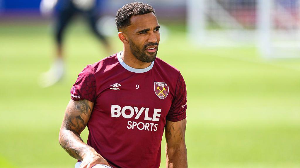 Callum Wilson stretching while warming up for West Ham