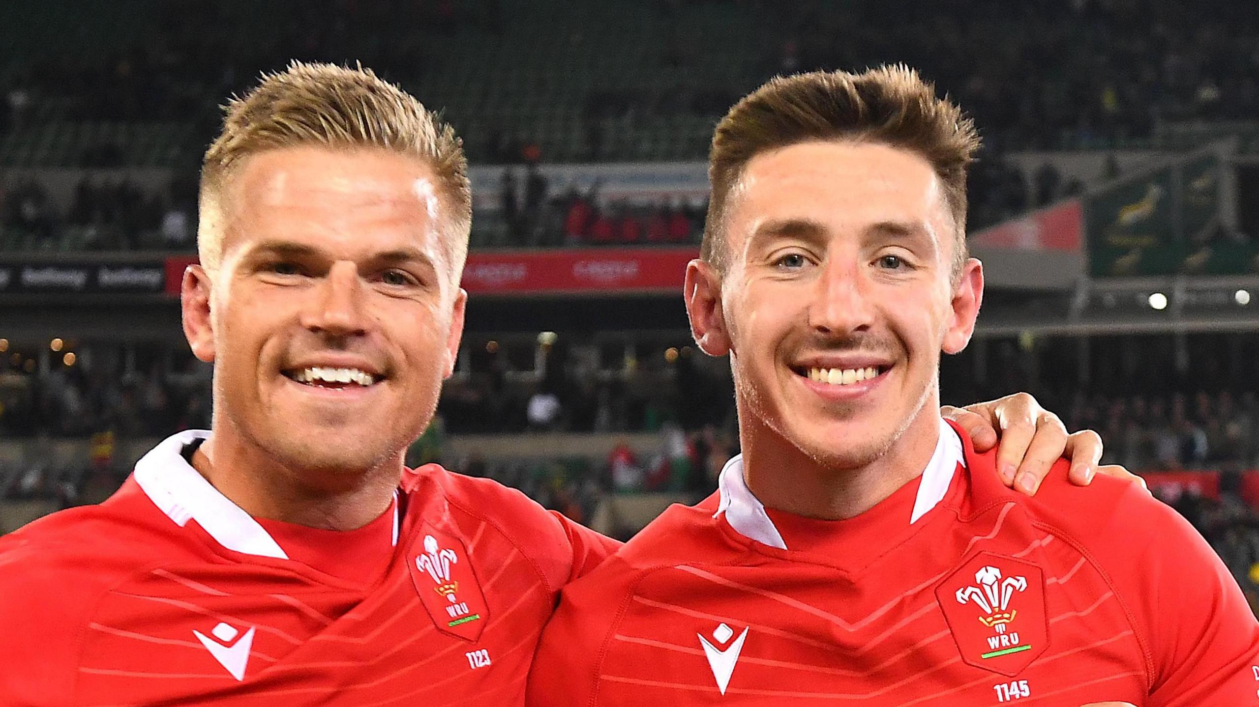 Gareth Anscombe and Josh Adams celebrate a Wales win in South Africa in 2022