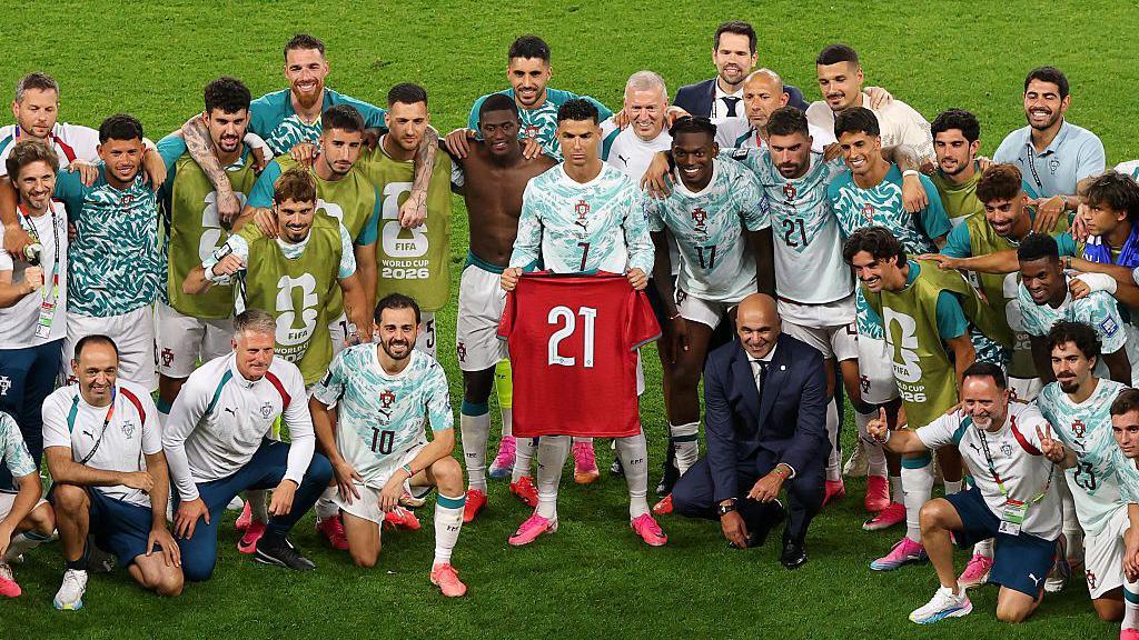 Cristiano Ronaldo holds Diogo Jota's '21' shirt aloft for Portugal