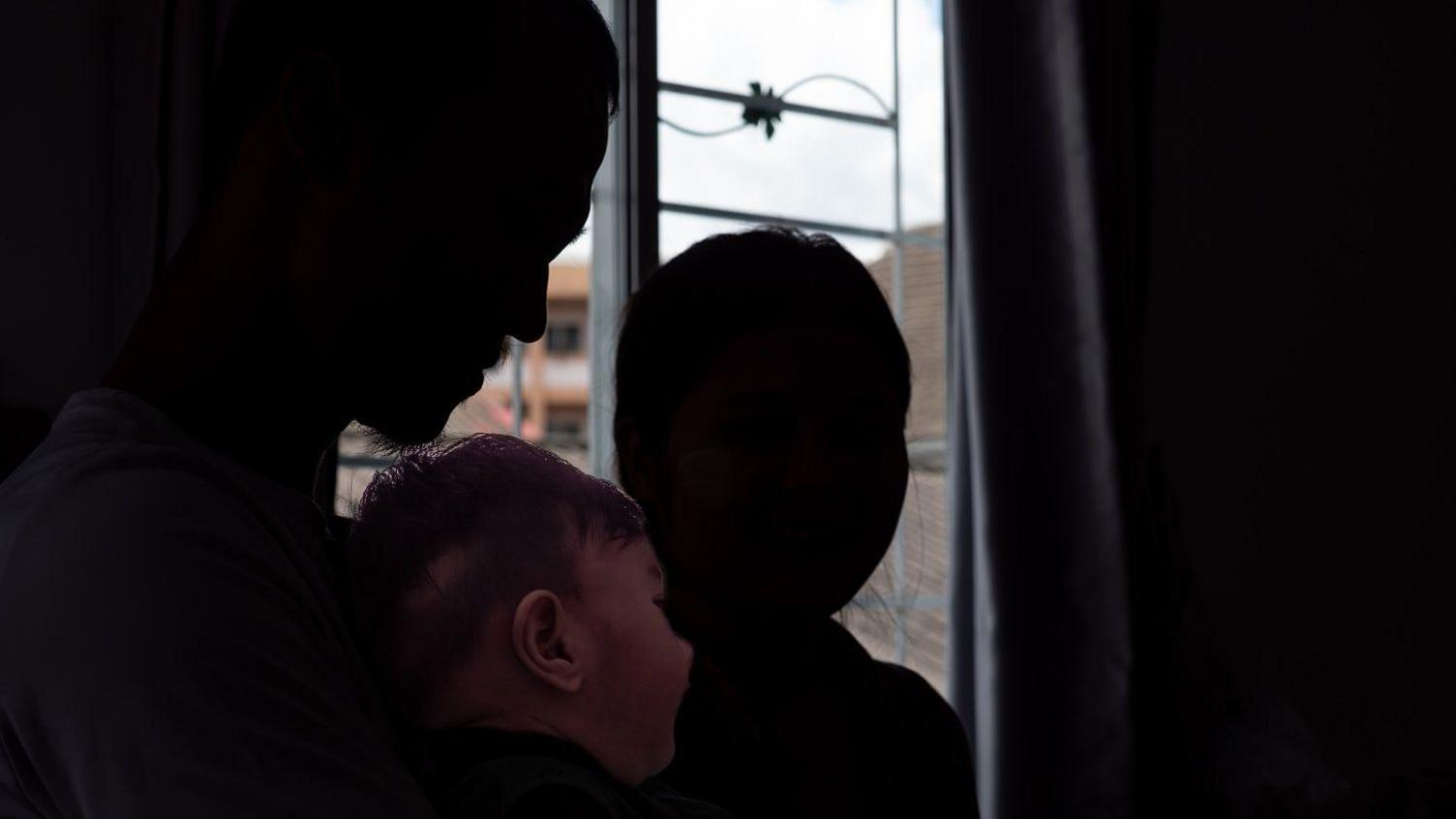 A resistance fighter, his child and wife in Mae Sot Thailand that borders Myanmar.