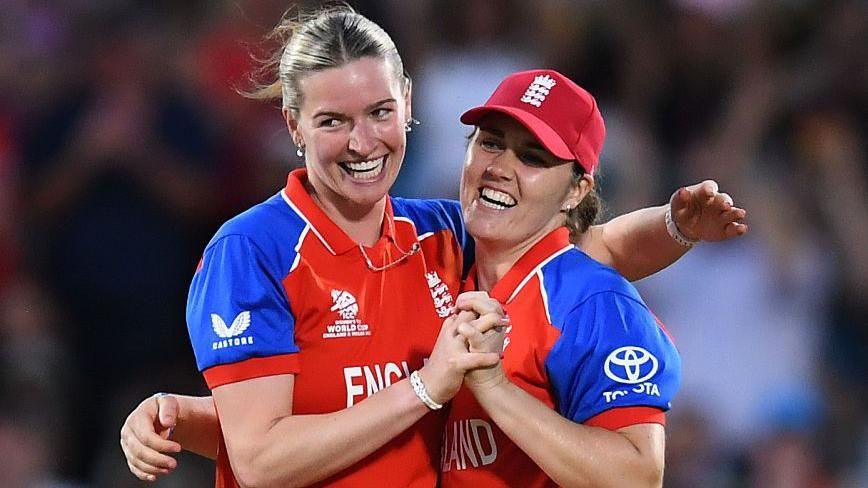 Lauren Bell and Nat Sciver-Brunt celebrate a wicket for England