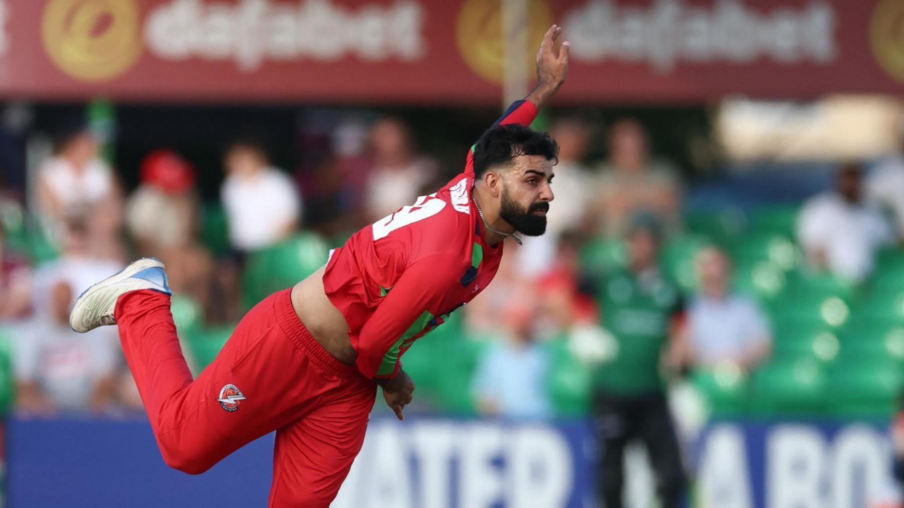 Lancashire spinner Shadab Khan in his bowling action