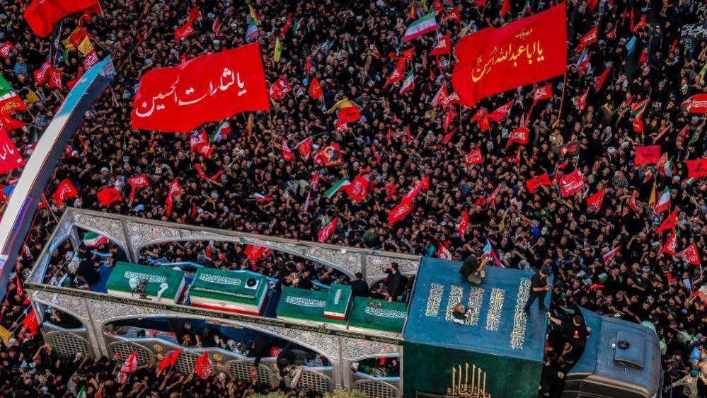 red flags and big crowds at Khamenei's funeral in Mashhad