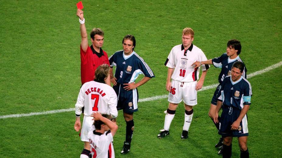 Referee Kim Milton Nielsen shows David Beckham of England a red card during the 1998 World Cup game against Argentina