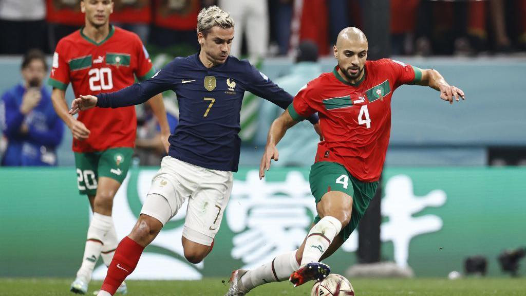 Antoine Griezmann of France tussles with Sofyan Amrabat of Morocco during the FIFA World Cup Qatar 2022 Semifinal match between France and Morocco at Al Bayt Stadium on December 14, 2022