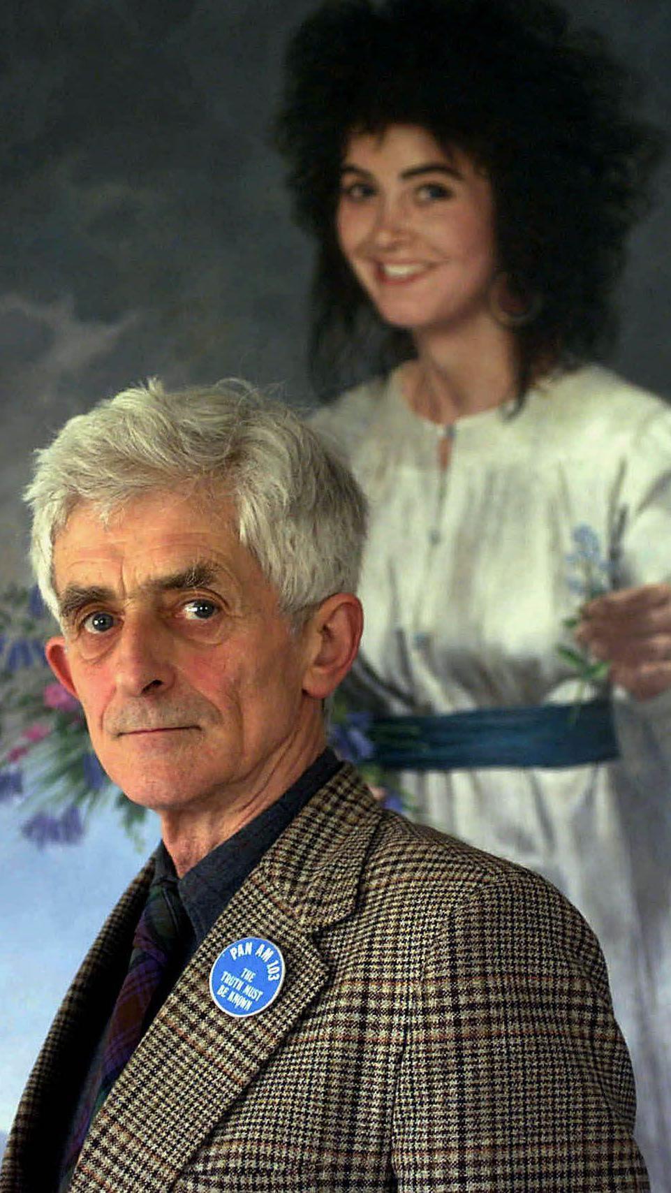Spokesman for the bereaved families of Pan Am flight 103 bombing over Lockerbie Dr. Jim Swire appears in front of a portrait of his daughter Flora, a victim of the bombing, April 25, 2000 in Scotland.