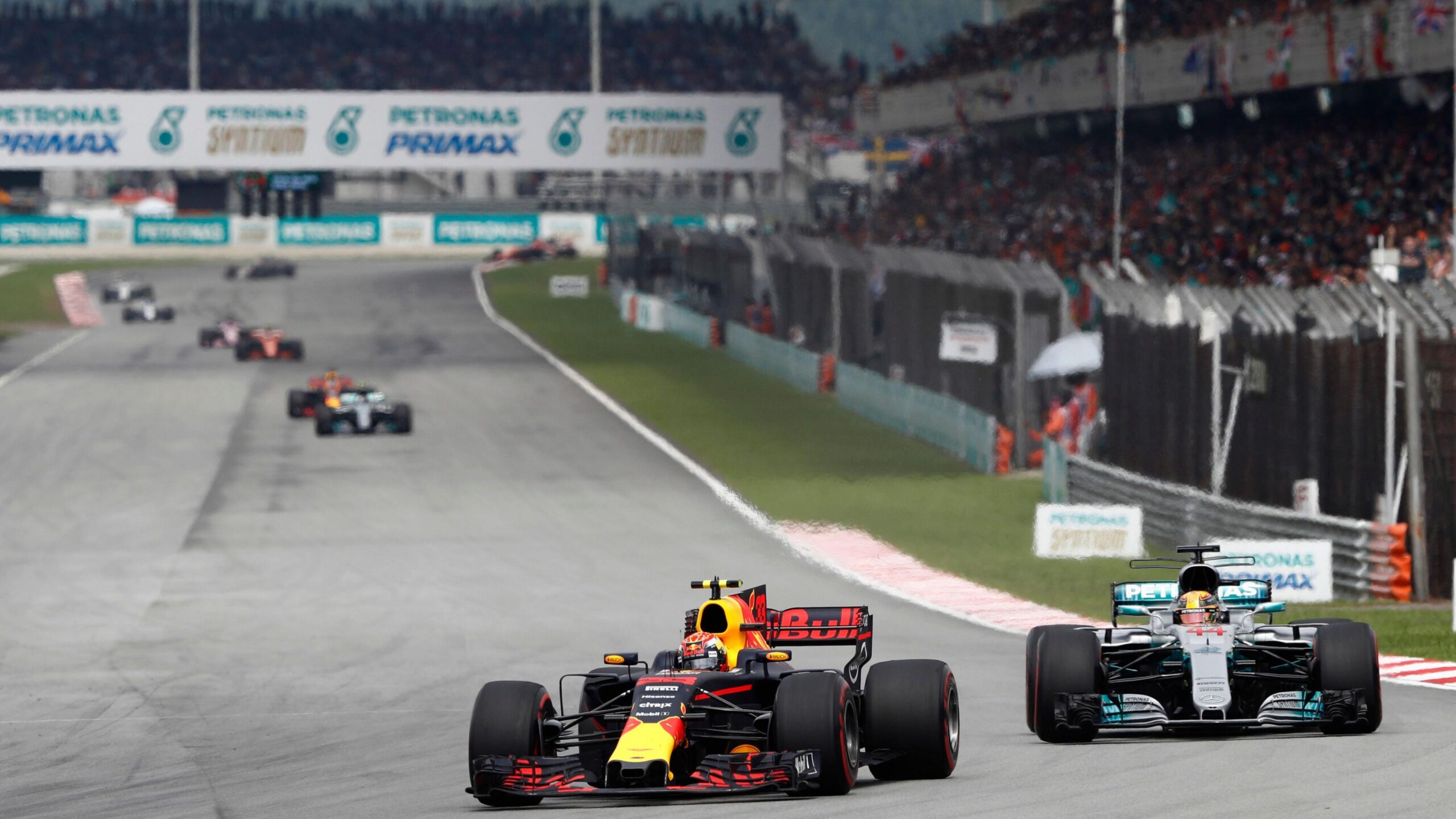 Red Bull's Max Verstappen leads Mercedes' Lewis Hamilton into the first corner of the 2017 Malaysian Grand Prix