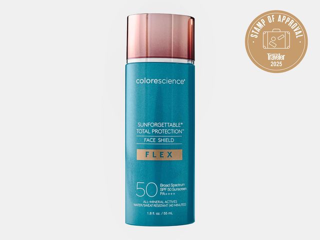 teal bottle of sunscreen with copper color lid