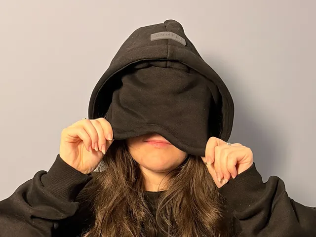 Image may contain: Clothing, Hoodie, Knitwear, Sweater, Sweatshirt, Hood, Brown Hair, Hair, Person, Adult, and Hat