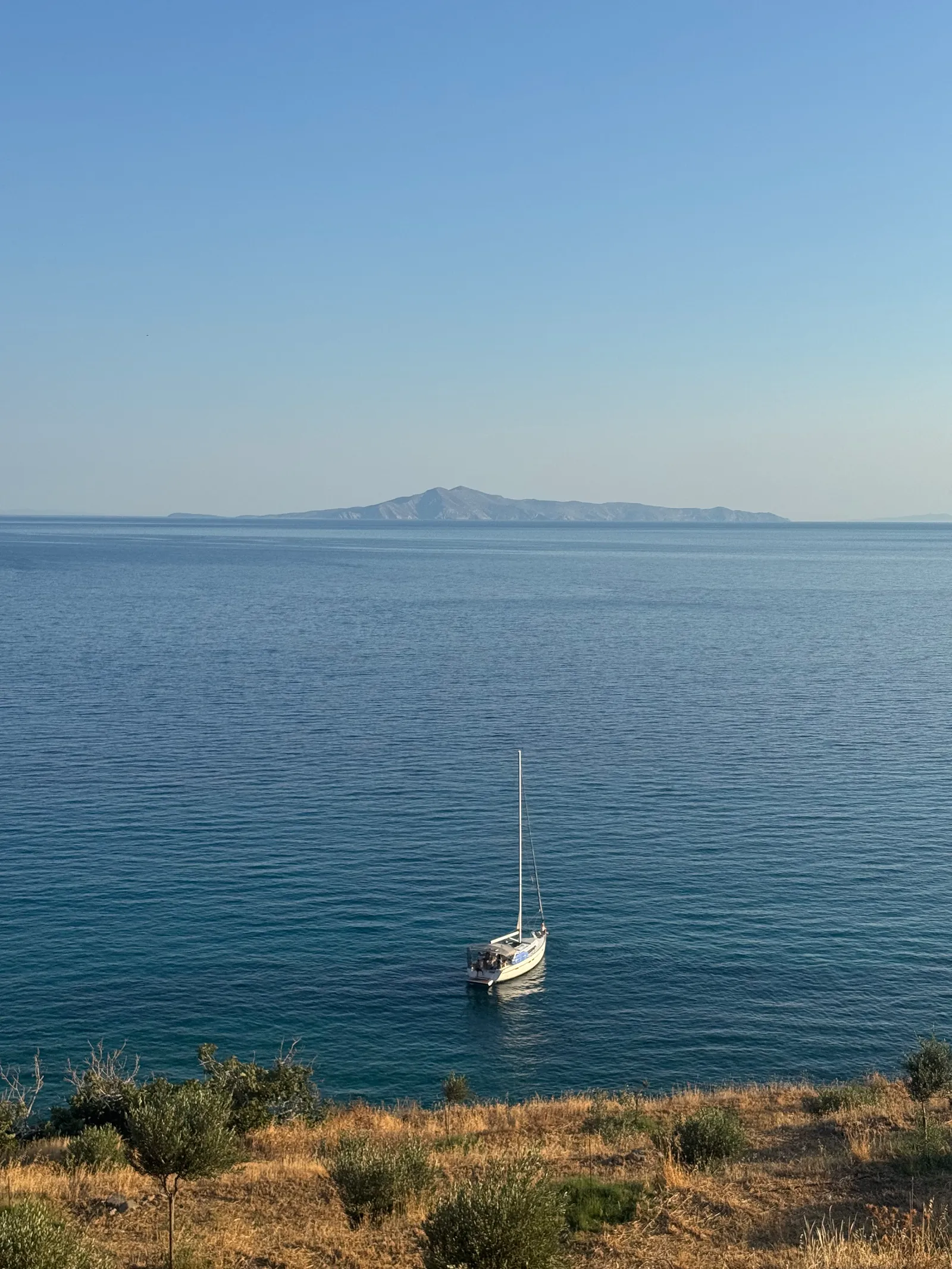 Image may contain Horizon Nature Outdoors Sky Boat Sailboat Transportation Vehicle Scenery Sea and Water