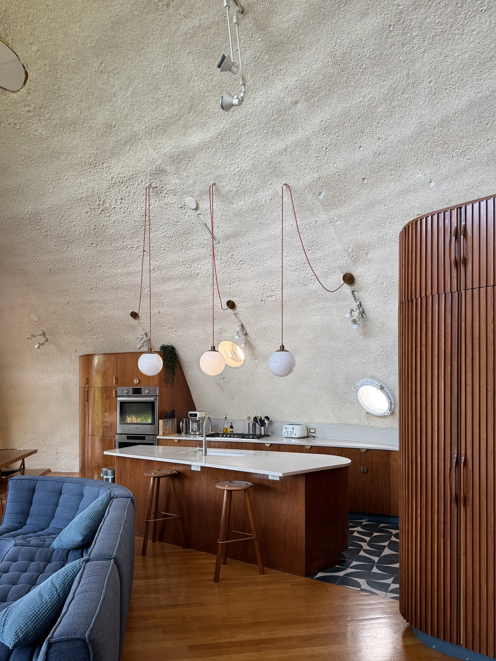 Image may contain Indoors Interior Design Wood Hardwood Wood Panels Kitchen and Floor