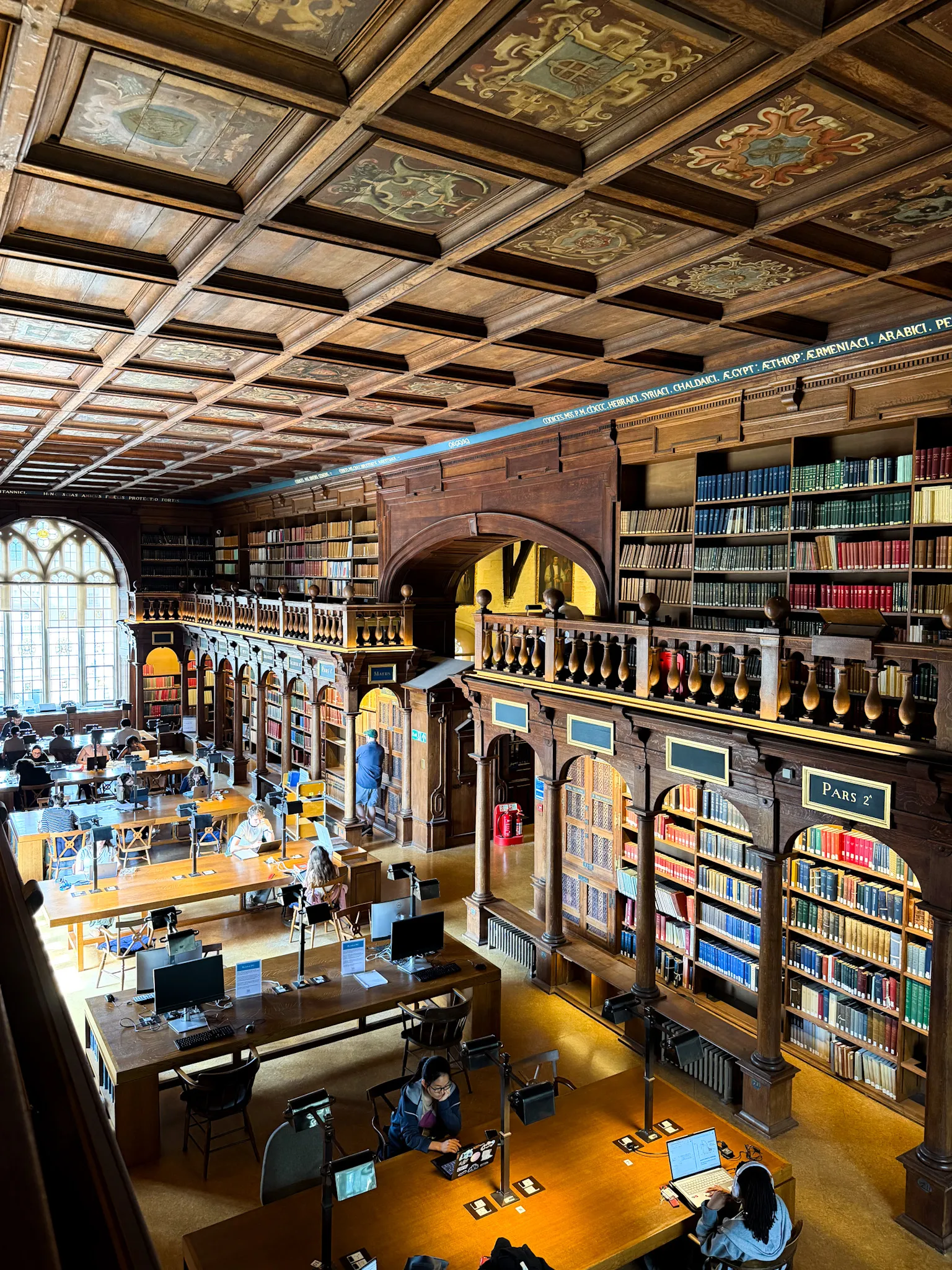Image may contain Book Indoors Library Publication Architecture Building Person Computer Hardware and Electronics