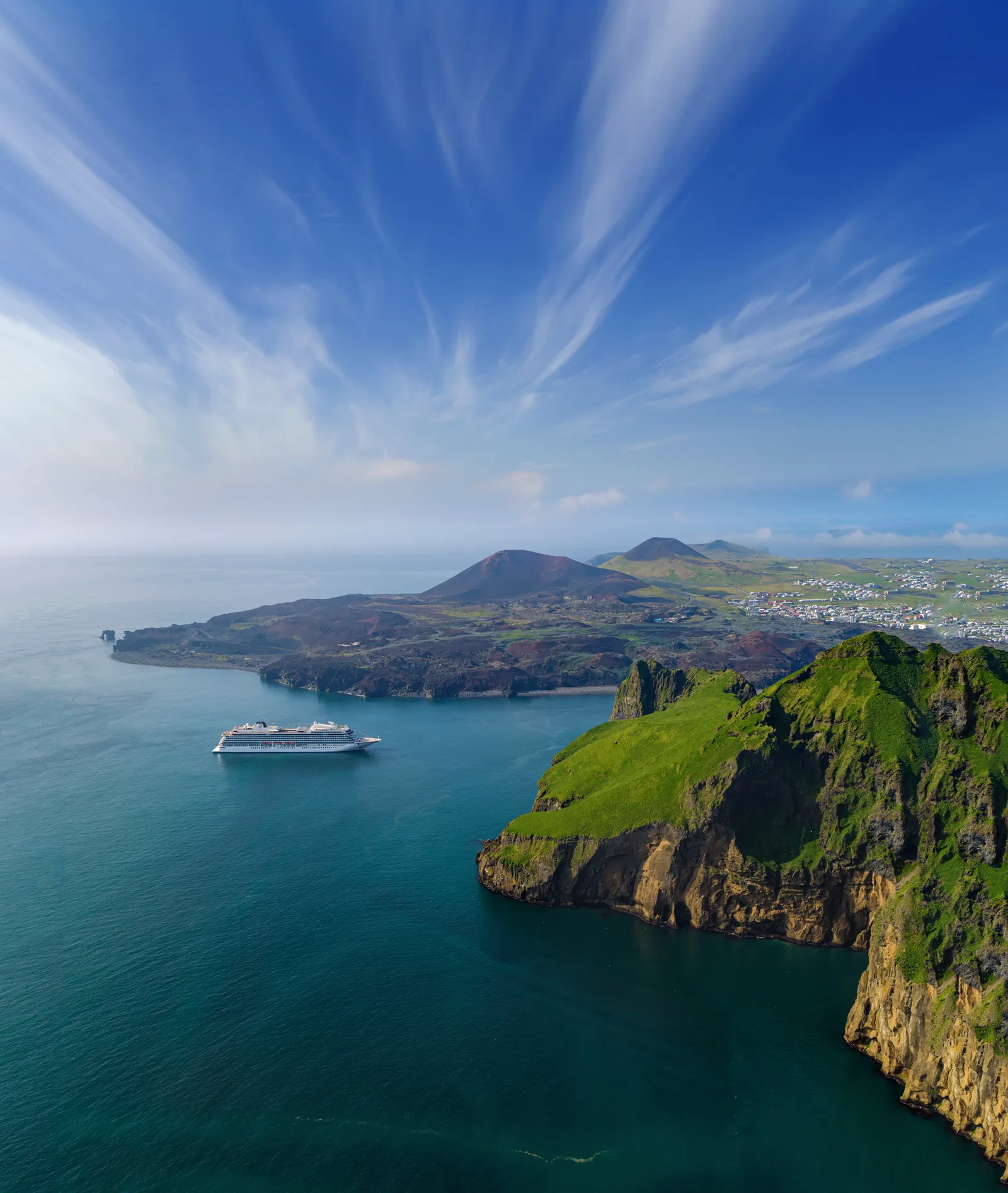 Image may contain Nature Outdoors Sea Water Land Promontory Boat Transportation Vehicle Coast and Shoreline