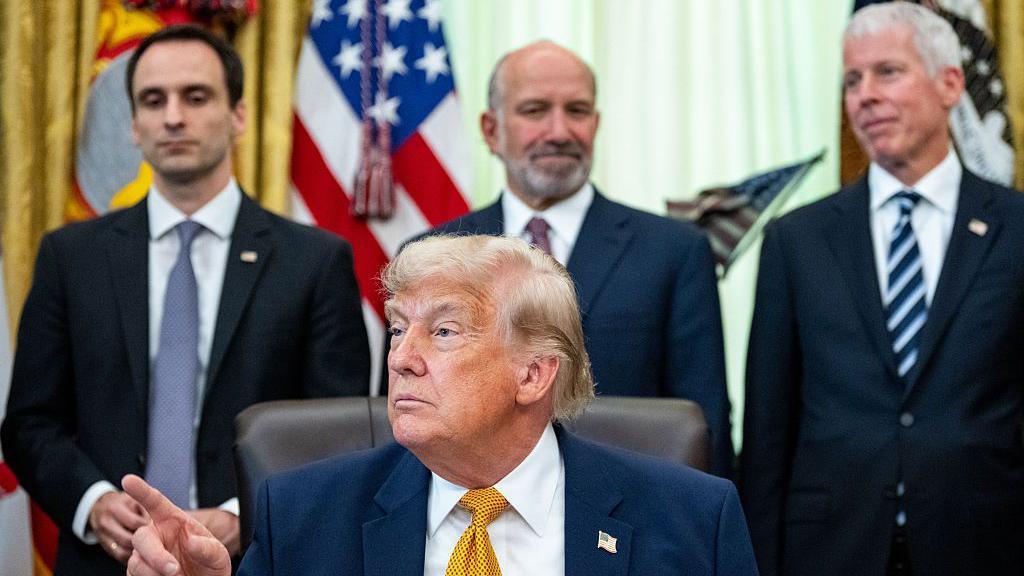 Michael Kratsios, director of the White House Office of Science and Technology Policy, from left, US President Donald Trump, Howard Lutnick, US commerce secretary, and Chris Wright, US energy secretary, during an executive order signing in the Oval Office of the White House in Washington, DC, US, on Monday, June 22, 2026.