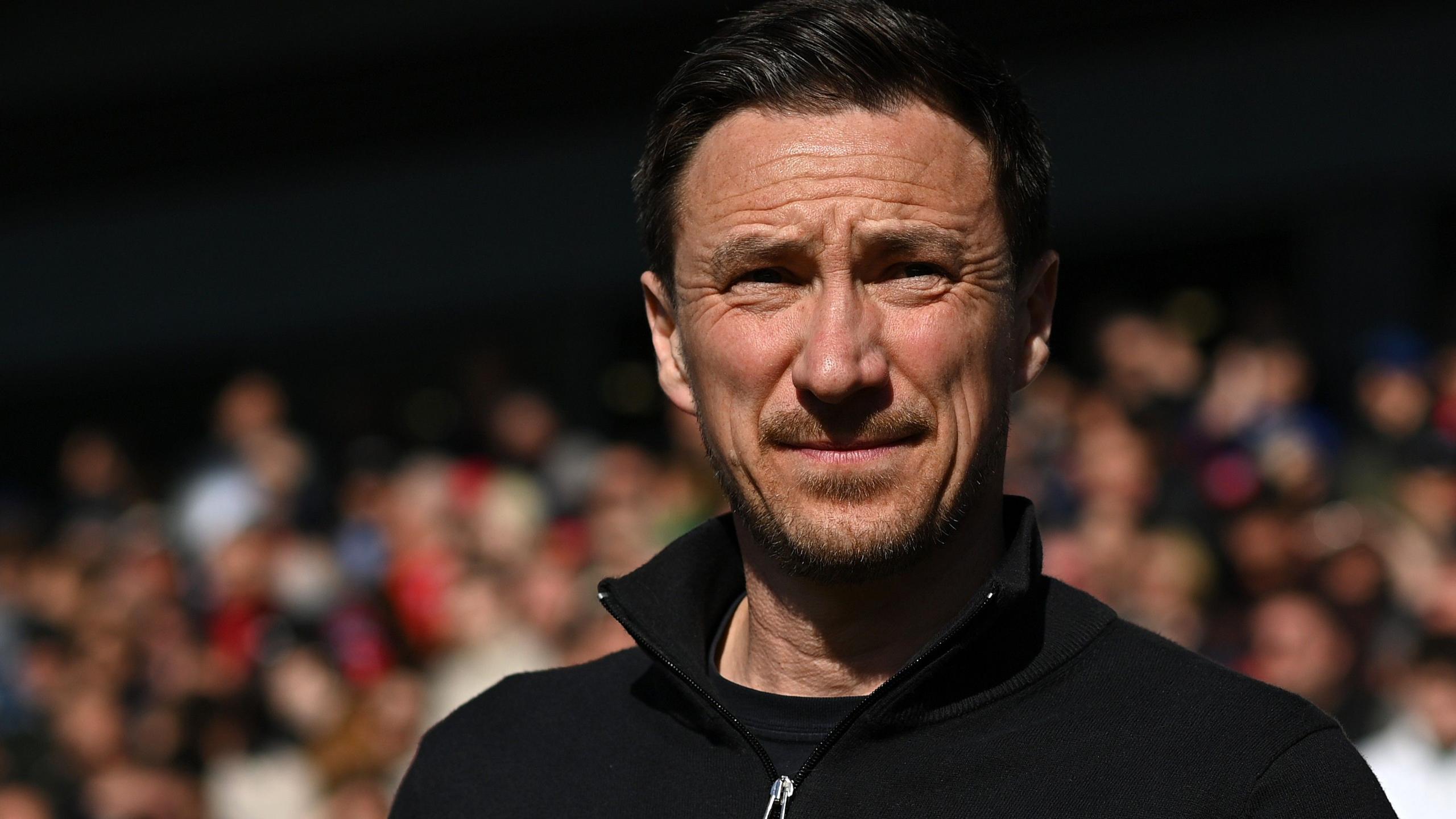 Stuart Maynard looks on wearing a black jumper