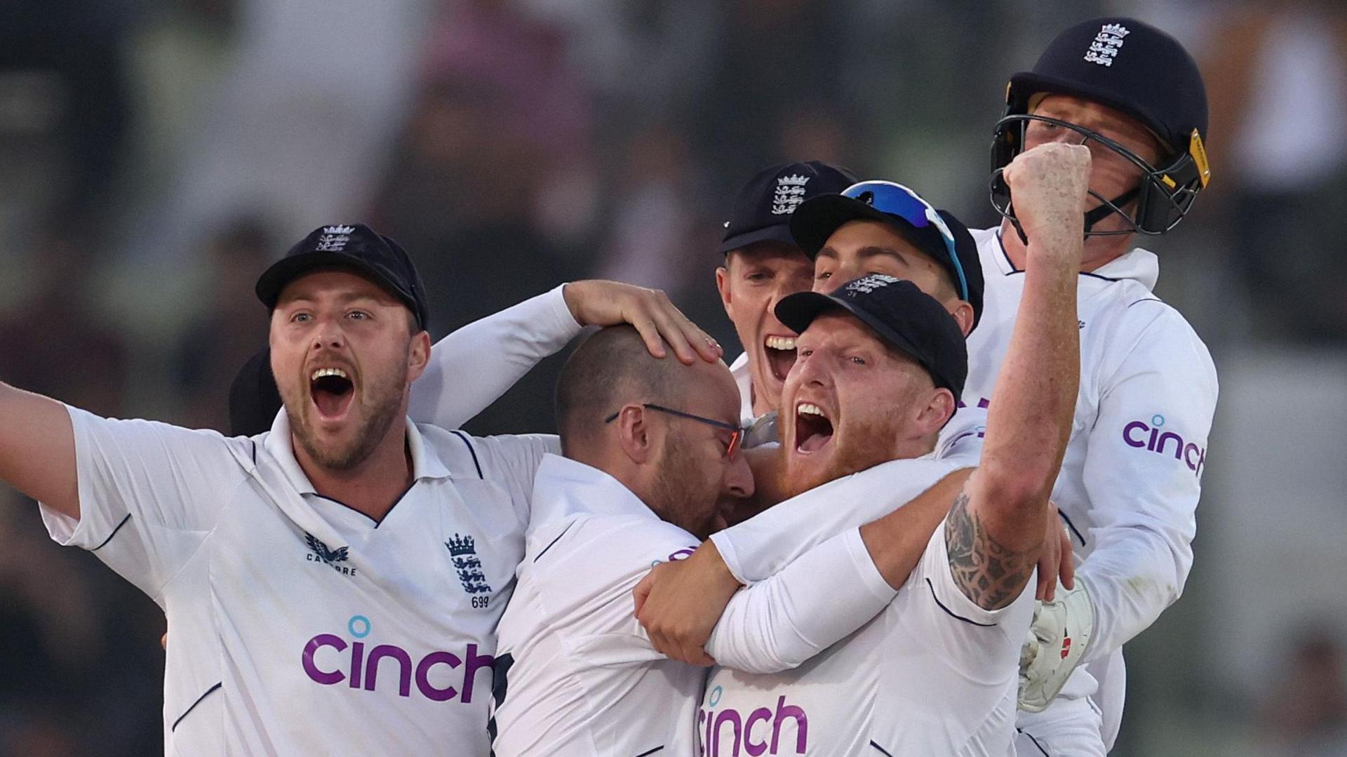 England players, including Ollie Robinson and Ben Stokes, celebrate victory in Rawalpindi in 2022
