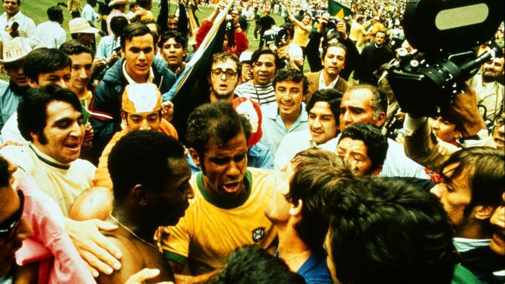Pele is mobbed after the 1970 final