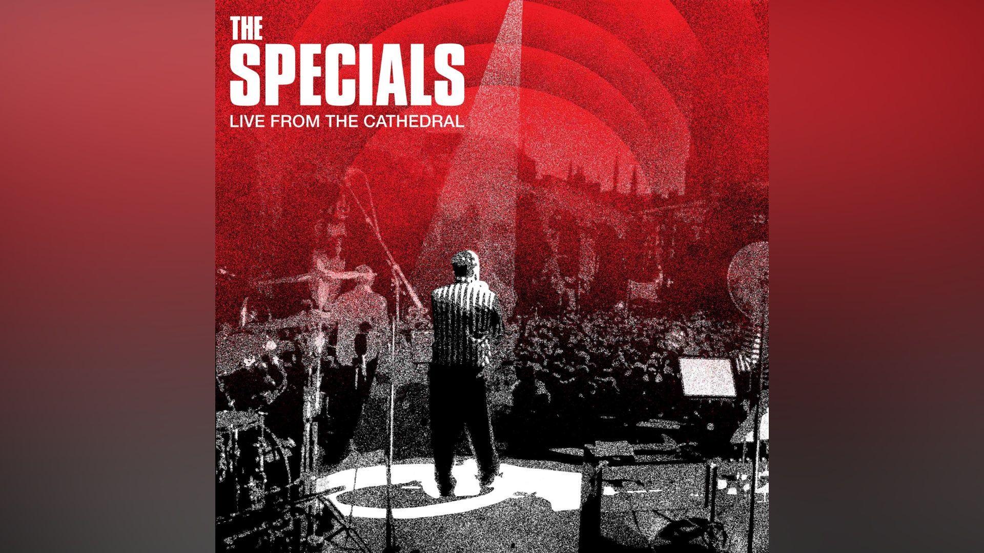 The artwork for the album Live from the Cathedral shows a black and white image taken from behind Terry Hall seen on stage with the audience in front of him