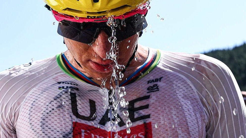 Tadej Pogacar douses himself in cold water at the Tour de France 2026