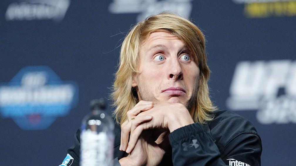 Paddy Pimblett reacts to the crowd at the UFC 329 news conference