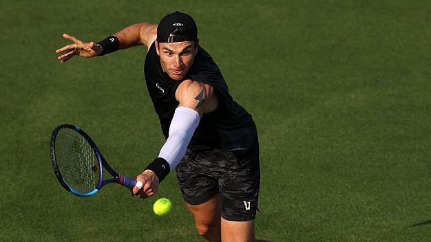 Jack Draper hits a return at Eastbourne