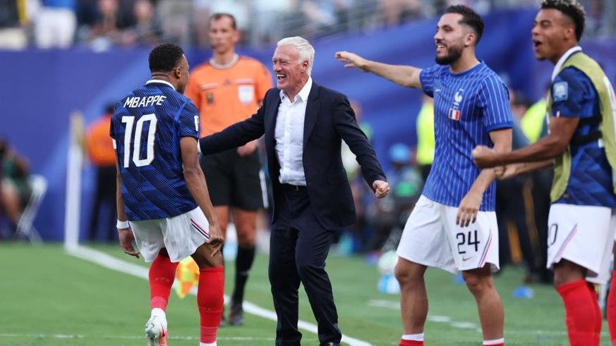 France boss Didier Deschamps celebrates with goalscorer Kylian Mbappe in the 3-0 win over Sweden at the World Cup