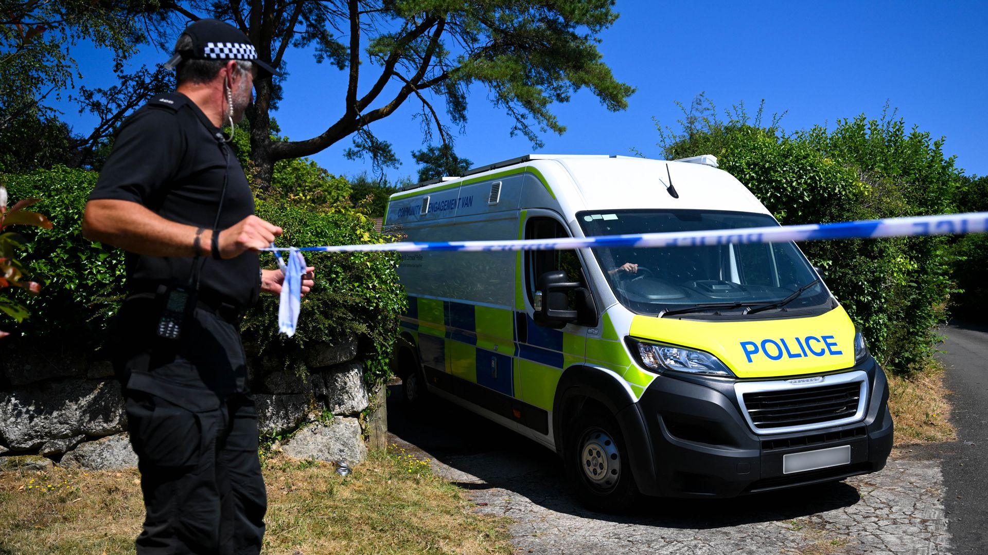 A police officer stands outside the house of Ann Widdecombe in Haytor on July 11, 2026 in Dartmoor, United Kingdom.
