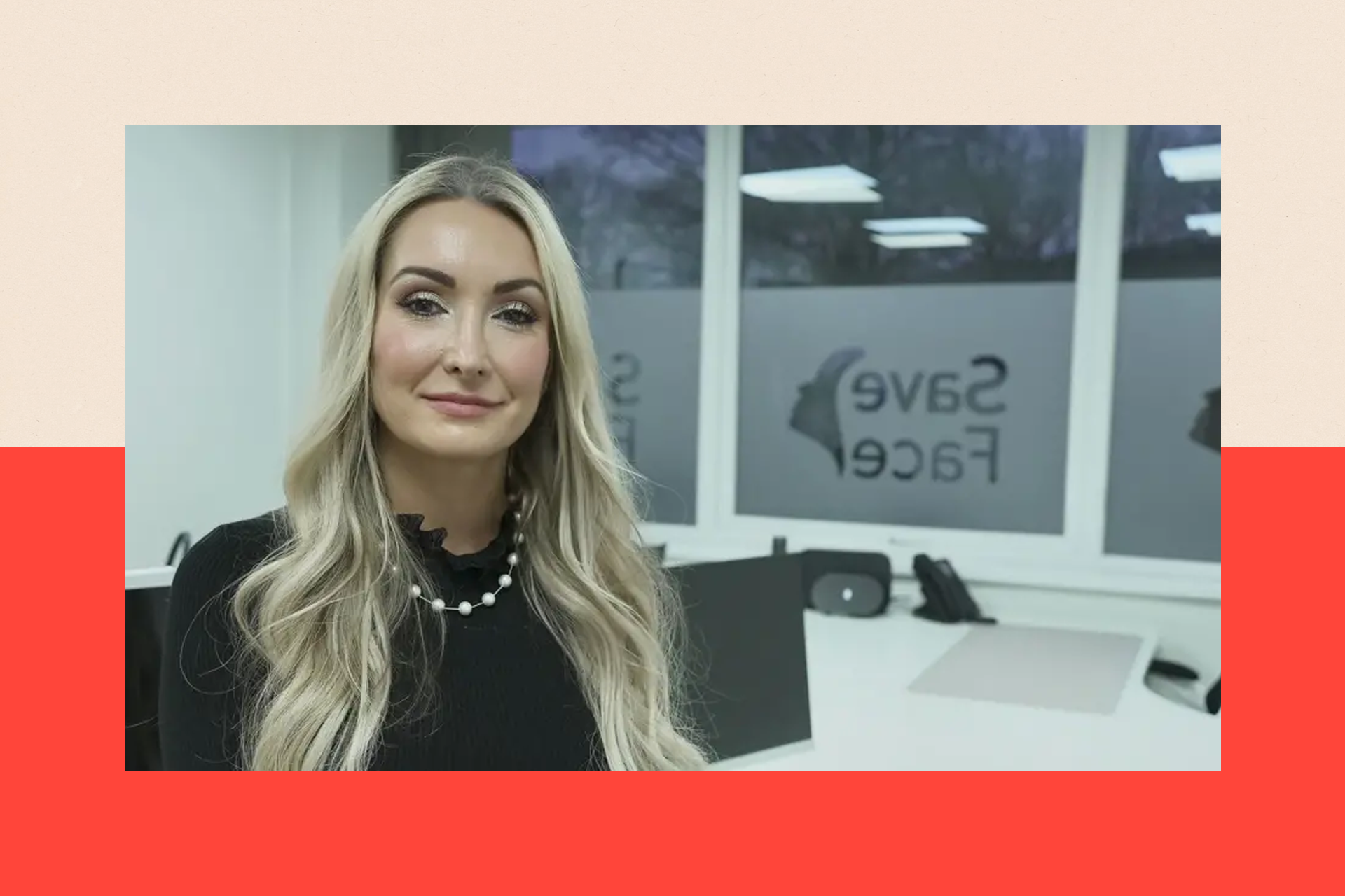 Ashton Collins, with long blonde hair, a black top, white necklace, sits in her white office. Visible on the window is the logo of her organisation, Save Face.