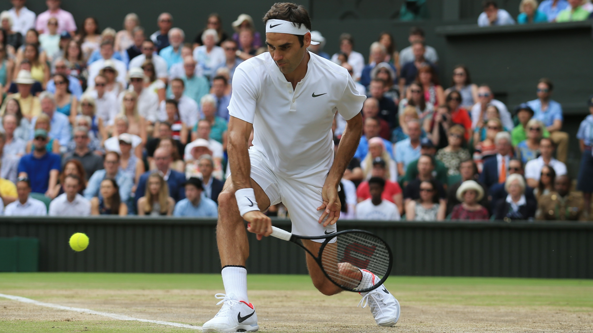 Roger Federer hits a backhand shot at Wimbledon 2017