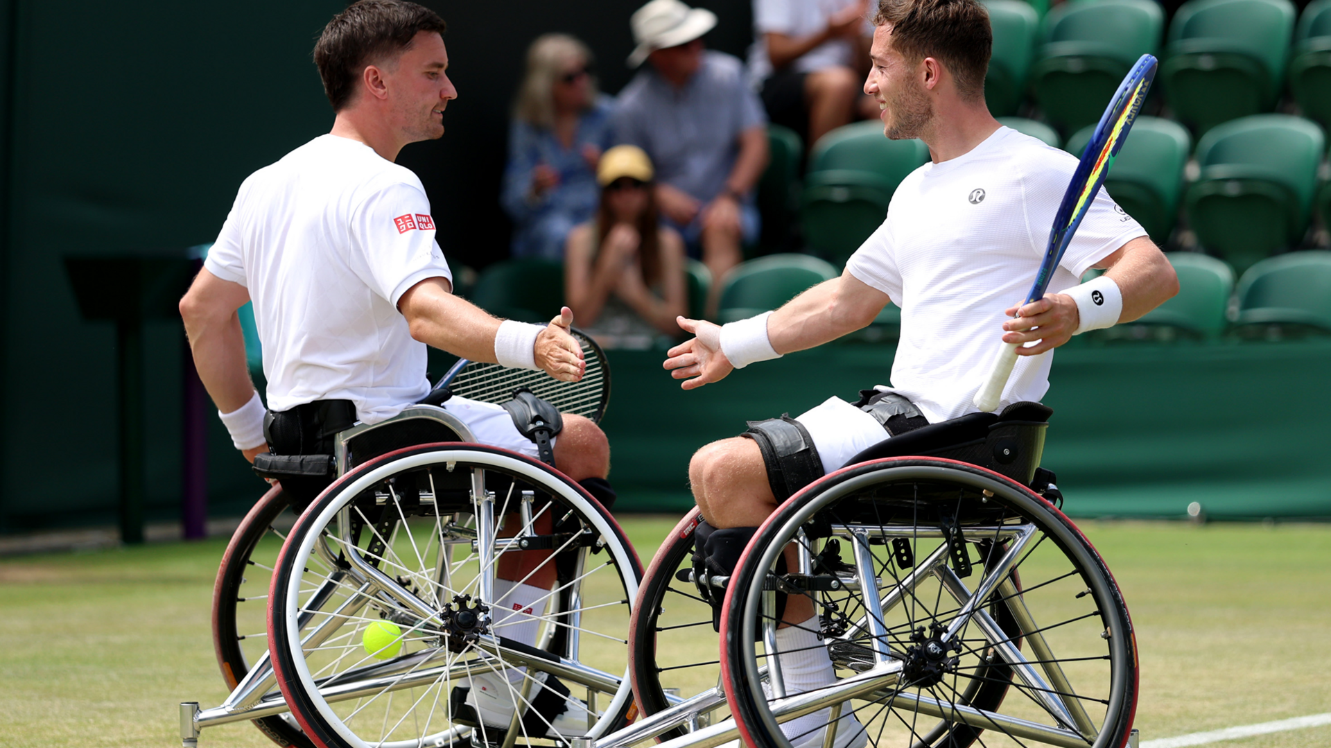 Gordon Reid and Alfie Hewett clap hands at Wimbledon
