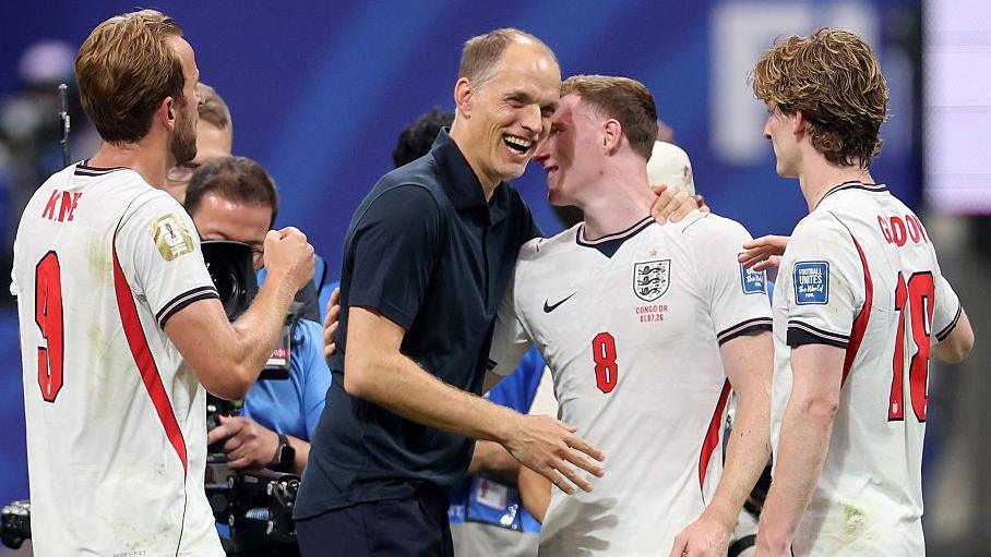 Thomas Tuchel embraces England players at the end of a World Cup game.
