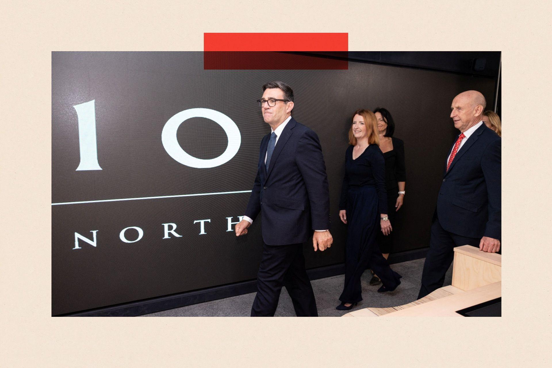 Britain's Prime Minister Andy Burnham walking past a sign which says 10 North