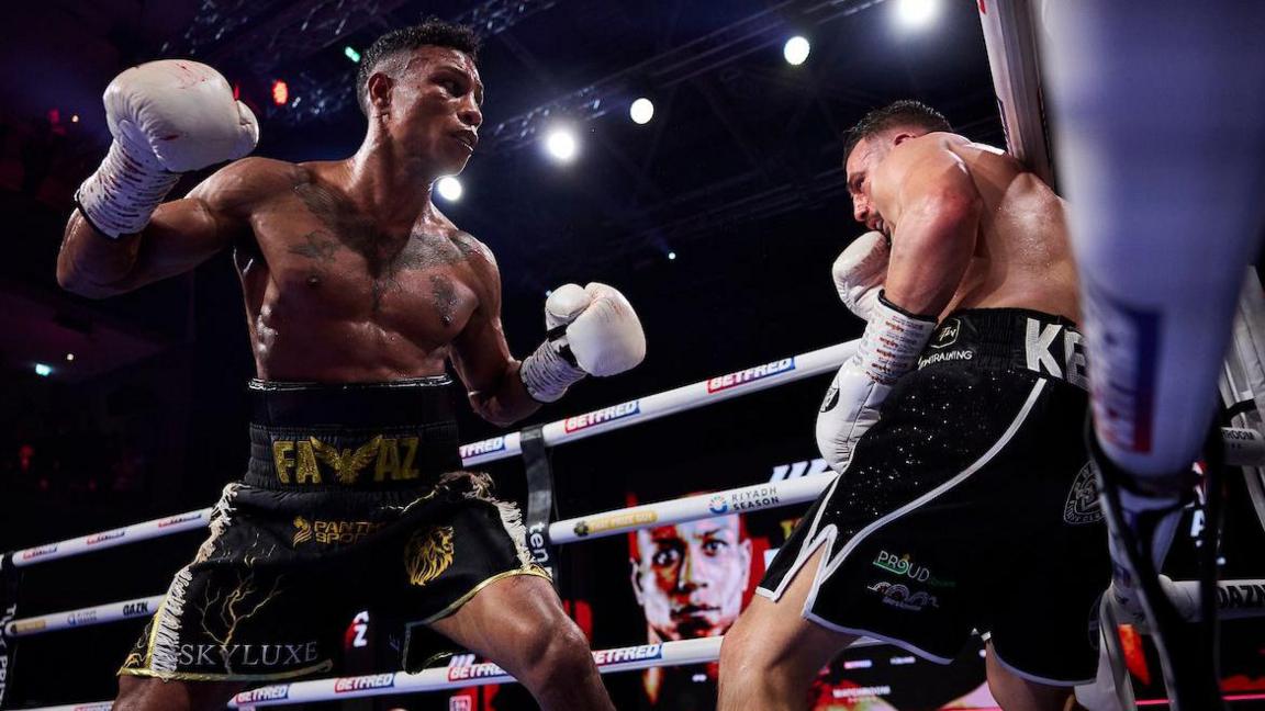 Bilal Fawaz backs Ryan Kelly on to the ropes in Wolverhampton