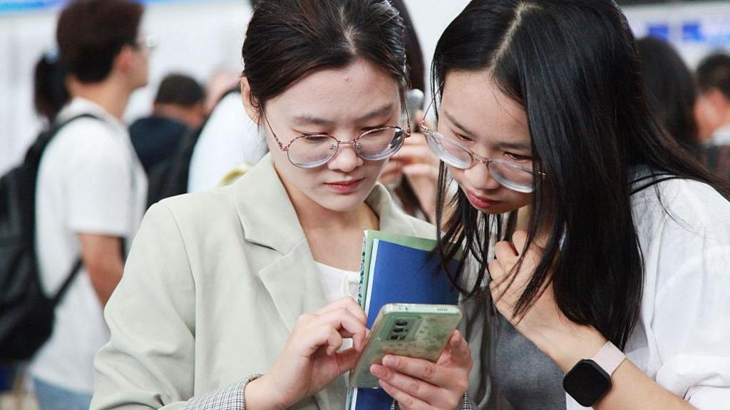 Job seekers look for opportunities at a job fair majorly for overseas returnees and PhD holders in Nanjing in east China's Jiangsu province Saturday, Sept. 20, 2025.