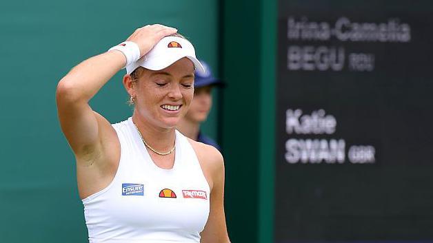 Katie Swan puts her hand on her head in celebration