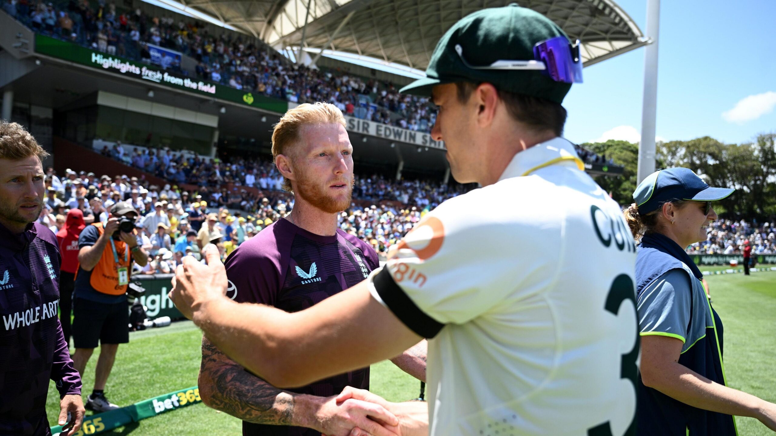 England captain Ben Stokes shakes hands with Australia captain Pat Cummins at the end of the Ashes Test at Adelaide
