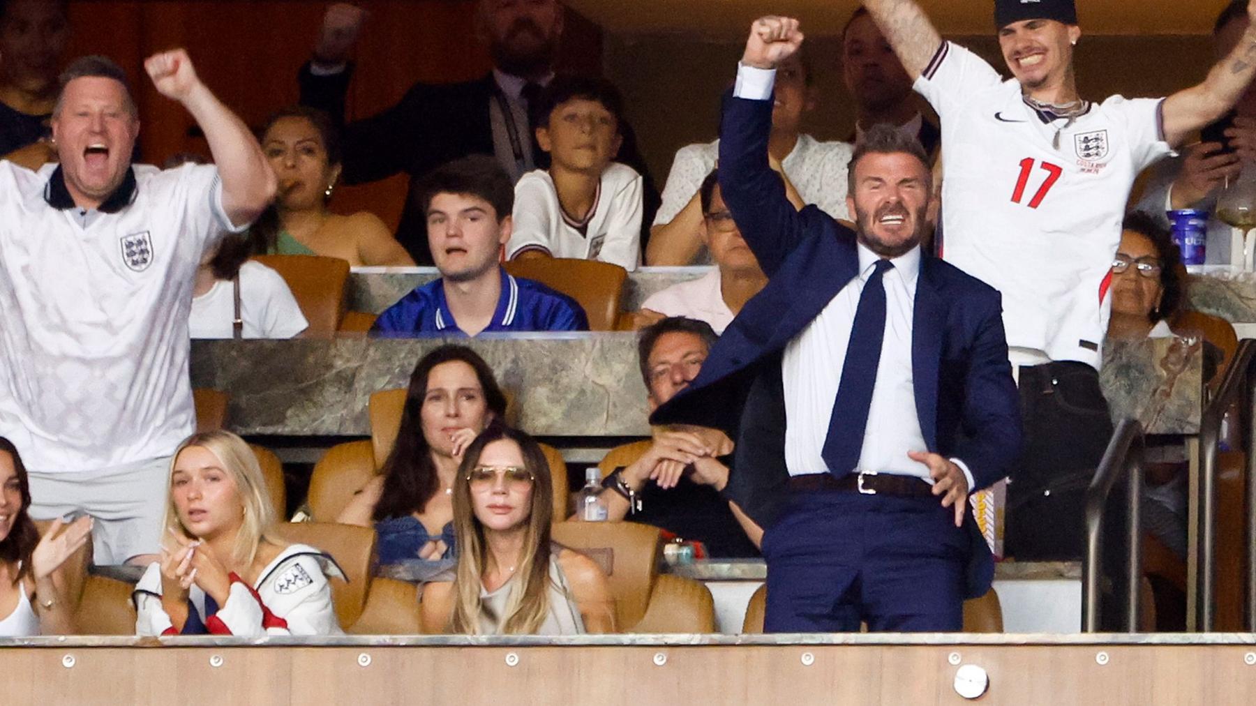 Victoria Beckham appeared stone-faced as her family react with cheers to England's victory against Norway at last week's match